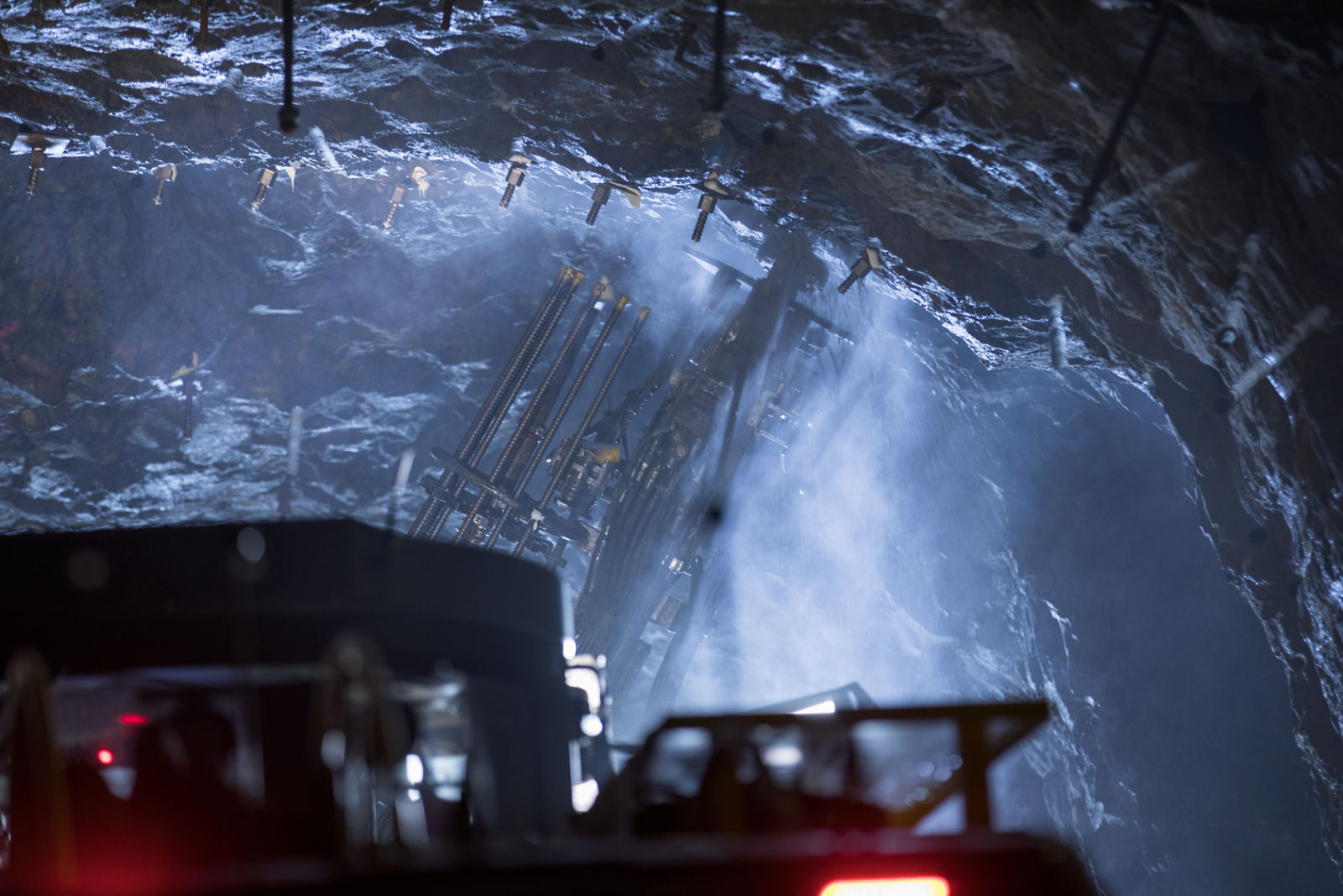 Boltec E with pumpable resin option, rear view of machine and bolting unit in underground mine, landscape orientation
